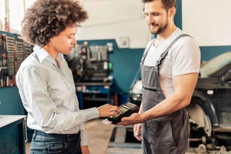 Paying-for-car-repair-with-credit-768x512-1